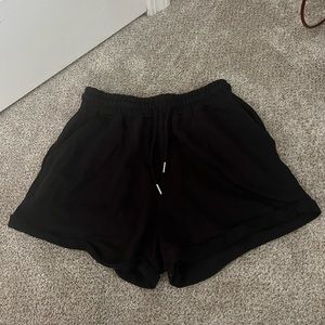 Black sweat shorts with elastic tie